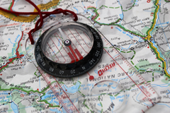 Graphic photo of map and compass